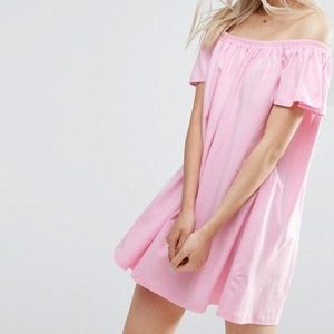 Off the shoulder pink dress.
